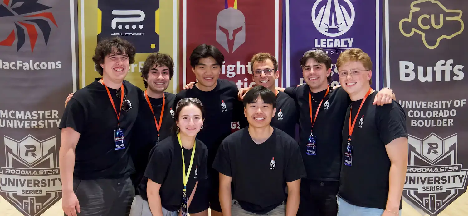 Queen's Knights team members with their robot